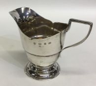 A small silver Georgian style cream jug. Birmingha