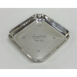A heavy cast silver ashtray with engraved decorati