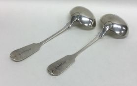 EXETER: A pair of silver fiddle pattern sauce ladl