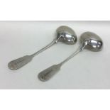 EXETER: A pair of silver fiddle pattern sauce ladl