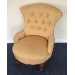 A small Edwardian button back armchair. Est. £25 -