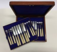 A cased set of twelve (plus twelve) dessert knives