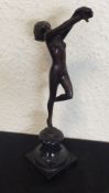 A small brass model of a lady on square pedestal b