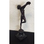 A small brass model of a lady on square pedestal b