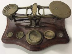 A set of chemist's scales and weights. Est. £20 -