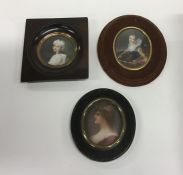 A group of three oval miniatures in wooden mounted