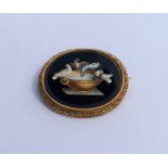 A large Italian micro-mosaic brooch in gold frame