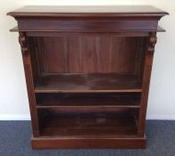 A small mahogany tall bookcase. Est. £30 - £50.