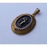 An Antique enamel and ruby pendant, the centre dec