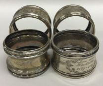 A set of four massive silver napkin rings with bea