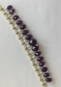An unusual seed pearl and amethyst necklace with l