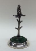 An unusual silver hatpin stand in the form of a tr
