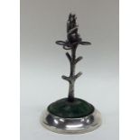 An unusual silver hatpin stand in the form of a tr