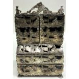 A miniature silver bureau bookcase profusely decor