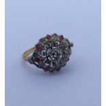 An attractive Edwardian diamond and ruby cluster r