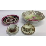 An attractive pink decorated plate together with a