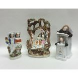 A group of three Staffordshire figures decorated w