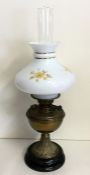 A brass mounted oil lamp on tapering base. Est. £3