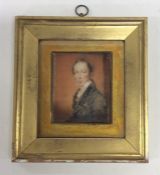 A gilt framed miniature of a gentleman. Est. £25 -
