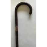 A gold mounted walking cane of tapering form. Est.