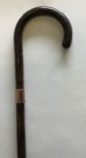 A gold mounted walking cane of tapering form. Est.
