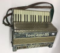 A Toscanelli accordion. Est. £20 - £30.