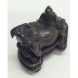 A bronze figure of an ox in recumbent position. Es