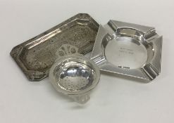 A silver engine turned ashtray together with a pin