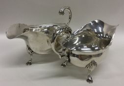 A pair of Georgian style silver sauce boats with c