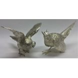 A pair of exquisite cast silver pheasants with tex