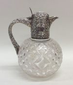 An attractive cut glass and silver topped lemonade