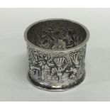 A good quality large silver napkin ring profusely