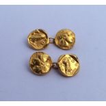 A pair of 18 carat cufflinks decorated with Greek