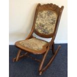 A pair of small mahogany rocking chairs with carve