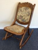 A pair of small mahogany rocking chairs with carve