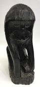 A carved Ethiopian hardwood figure of a monkey. Ap