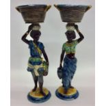 A pair of blue ground figures of ladies holding ba