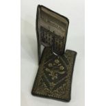 A miniature leather bound "The Almanac Explained"