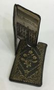 A miniature leather bound "The Almanac Explained"