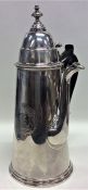 A rare silver Queen Anne tapering chocolate pot wit
