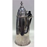 A rare silver Queen Anne tapering chocolate pot wit