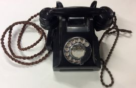 An old TMC Bakelite telephone. Est. £30 - £40.