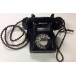 An old TMC Bakelite telephone. Est. £30 - £40.