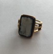 A hard stone cameo gent's signet ring in gold band