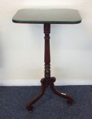 A Continental mahogany pedestal wine table with gl