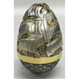 STUART DEVLIN: A silver and silver gilt egg of typ