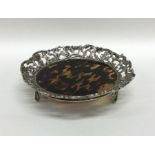 A stylish silver and tortoiseshell letter tray emb