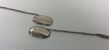 A rare pair of Scottish silver wine labels with re