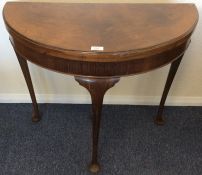 An Edwardian hinged top D-shaped card table. Est.