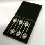A cased set of silver nail top coffee spoons. Lond